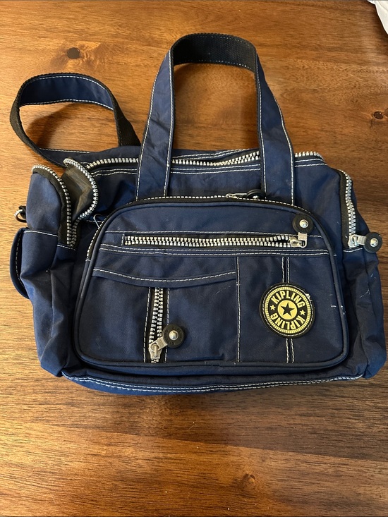 Kipling Handbags - Kipling Navy Blue Nylon Messenger Bag with Yellow Logo